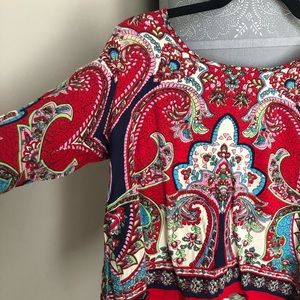 Francesca’s red blouse